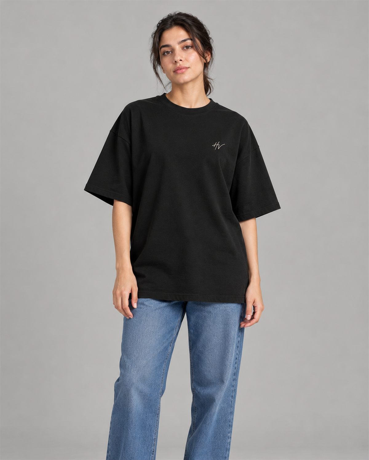 Woman wearing the black HALVERE oversized tee